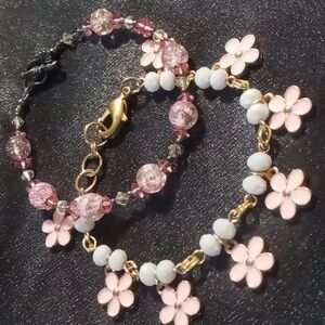 Girls bracelets 2 7.5 inches long strung on wire. Glass crystal cut & gold tone